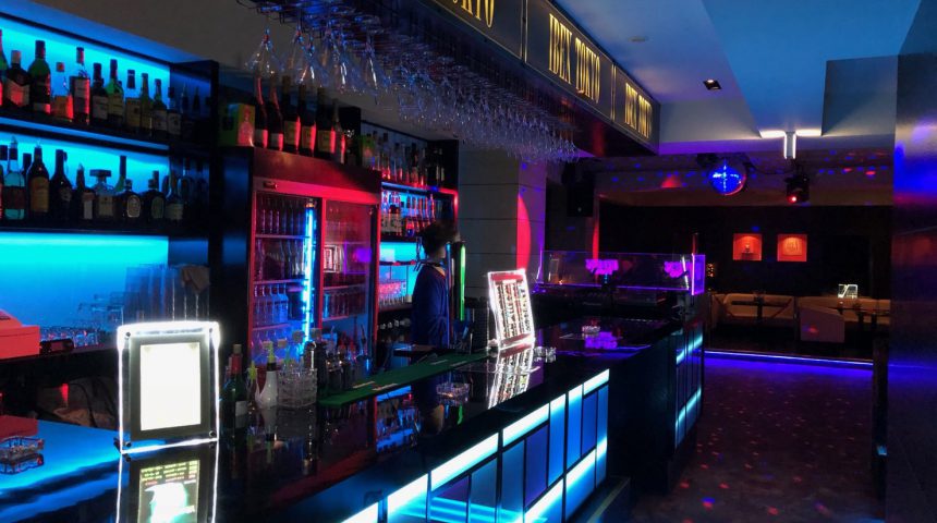 Main bar and lounge area with illuminated counters